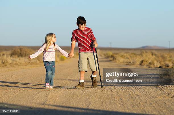 walking - cerebral palsy stock pictures, royalty-free photos & images