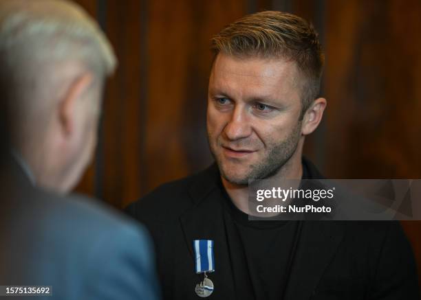 Jakub Blaszczykowski at the Krakow City Office during a meeting with the Mayor of the City, where he receives the 'Honoris gratia' award, which is...