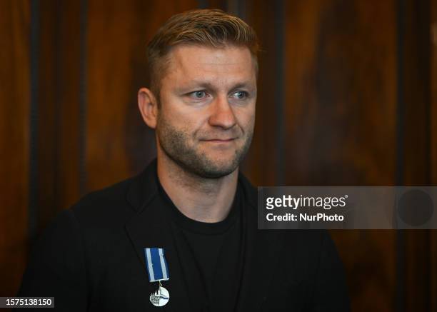 Jakub Blaszczykowski at the Krakow City Office during a meeting with the Mayor of the City, where he receives the 'Honoris gratia' award, which is...