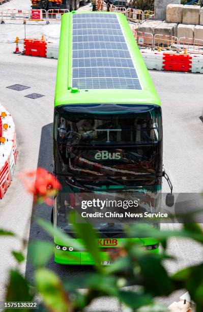 Solar panels are set on the roof of a double-decker KMB eBus on July 27, 2023 in Hong Kong, China. Kowloon Motor Bus Company announced that its...