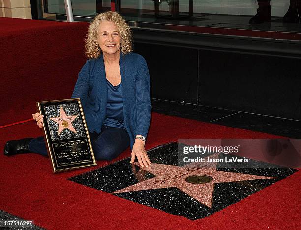 Carole King is honored with a star on the Hollywood Walk of Fame on December 3, 2012 in Hollywood, California.