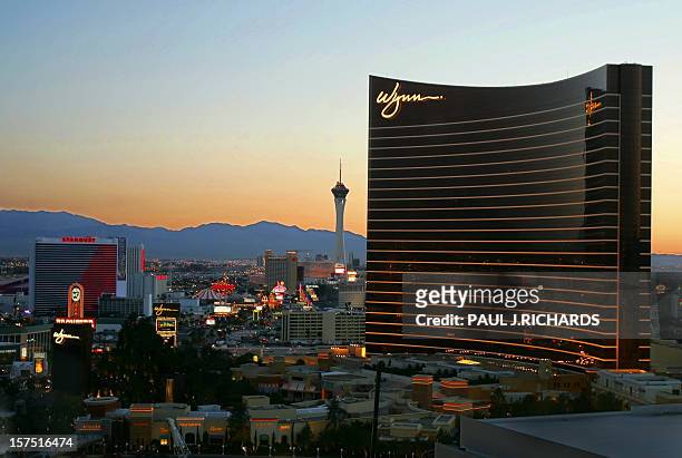 The newlyopened Wynn Hotel towers above the city as the sun rises over Las Vegas, Nevada 03 May 2005 . AFP Photo/Paul J. RICHARDS