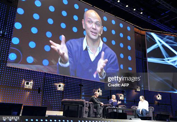 LeWeb co-founder Loic Le Meur and Xavier Niel, Founder of the Iliad Group listen to Tony Fadell, Founder and CEO of Nest Labs, Inc ( during the...