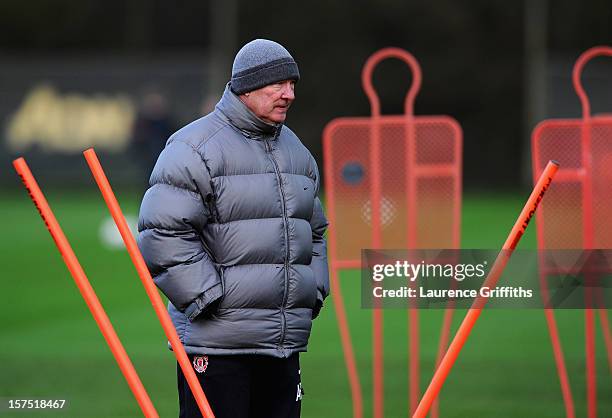 Sir Alex Ferguson of Manchester United looks on during a training session ahead of their Champions League group stage match against CFR 1907 Cluj at...