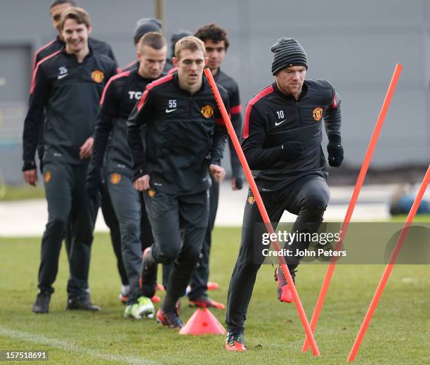 Wayne Rooney of Manchester United in action during a first team training session, ahead of their UEFA Champions League Group H match against CFR 1907...