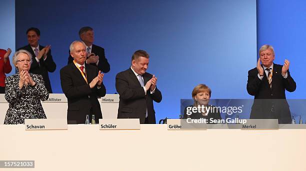 Leading members of the German Christian Democratic Union applaud German Chancellor and CDU Chairwoman Angela Merkel after she spoke at the CDU...