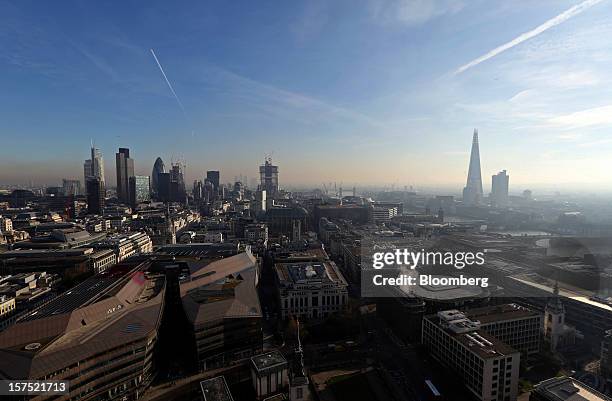 Skyscrapers and construction sites for new commercial real estate developments stand on the skyline of the financial district in London, U.K., on...