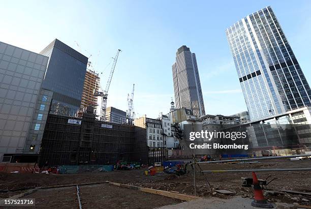 The empty construction site of 100 Bishopsgate is seen between St. Helens, the Aviva Plc building, left, and Tower 42, center, in the financial...