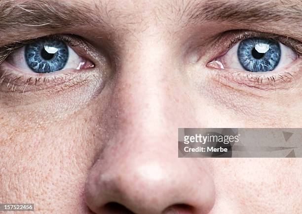 blue eyes - male blue eyes stock pictures, royalty-free photos & images