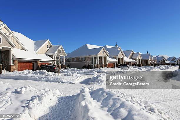 suburban street in winter - minnesota snow stock pictures, royalty-free photos & images