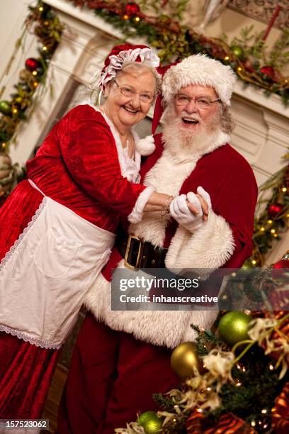 pictures of real santa dances with mrs. claus - mrs claus stock pictures, royalty-free photos & images