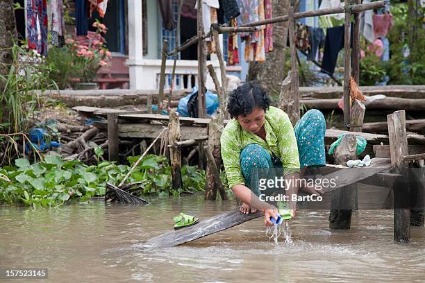 vietnam, washing in river near can tho. - river mekong stockfoto's en -beelden