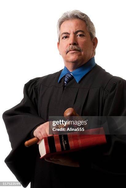 mature distinguished judge with gavel and law book on white - serious crimes court stock pictures, royalty-free photos & images