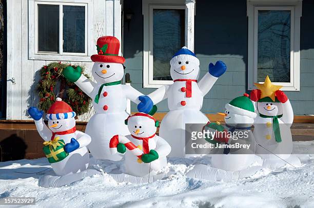 happy snowman family enjoying winter day together in snow, sunshine - snowman isolated stock pictures, royalty-free photos & images