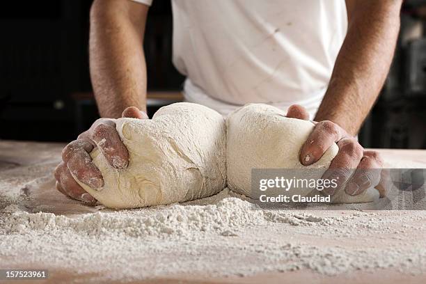 hands kneading dough - gluren stock pictures, royalty-free photos & images