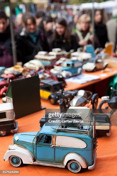 close-up of car toys at outdoor flea market in madrid spain - rommelmarkt stockfoto's en -beelden