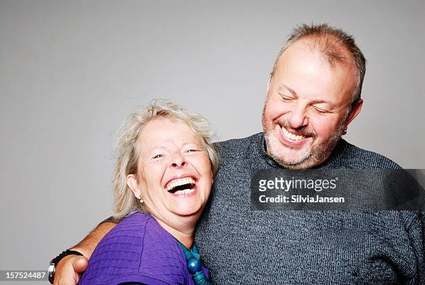 happy senior couple - couple studio stock pictures, royalty-free photos & images