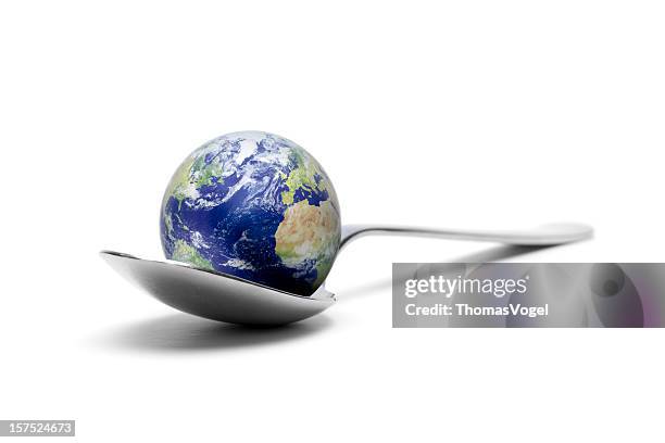 earth on spoon xxxl - petite cuisine stock pictures, royalty-free photos & images