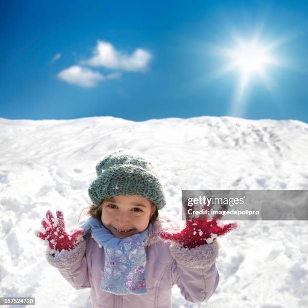 happy little girl playing snowball - december 6 stock pictures, royalty-free photos & images