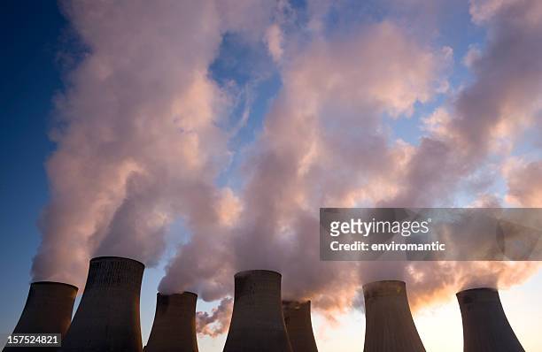 cooling towers at a coal fueled power station. - air pollution stock pictures, royalty-free photos & images