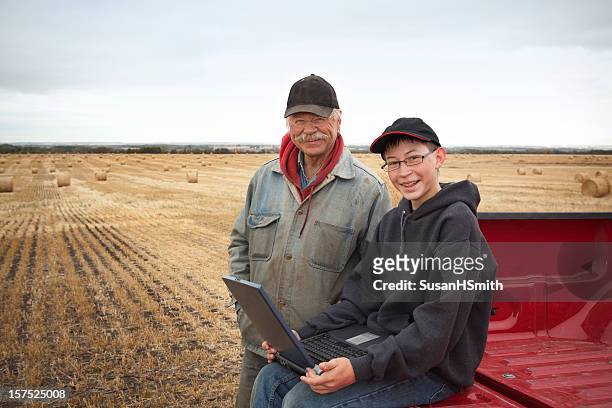 farmers with computer - alberta prairie stock pictures, royalty-free photos & images