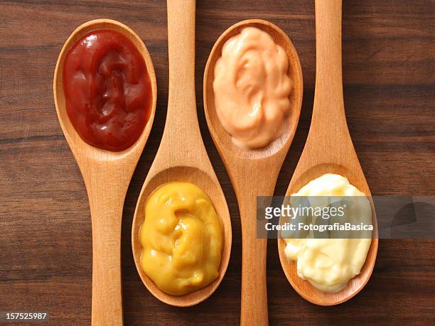 condiments and spoons - sauce stock pictures, royalty-free photos & images