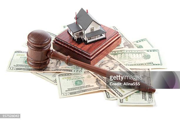 gavel, sound block and money with model house on white - bankruptcy law stock pictures, royalty-free photos & images