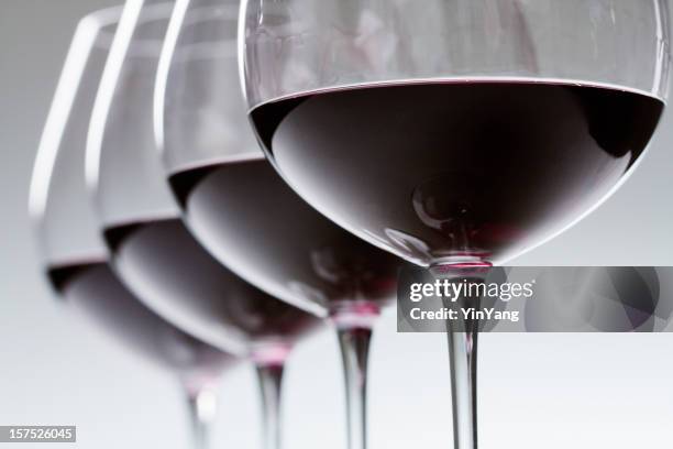 red wine winetasting glasses in a row, alcohol tasting close-up - wijn proeven stockfoto's en -beelden