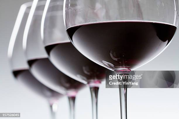 red wine winetasting glasses in a row, alcohol tasting close-up - winetasting stock pictures, royalty-free photos & images