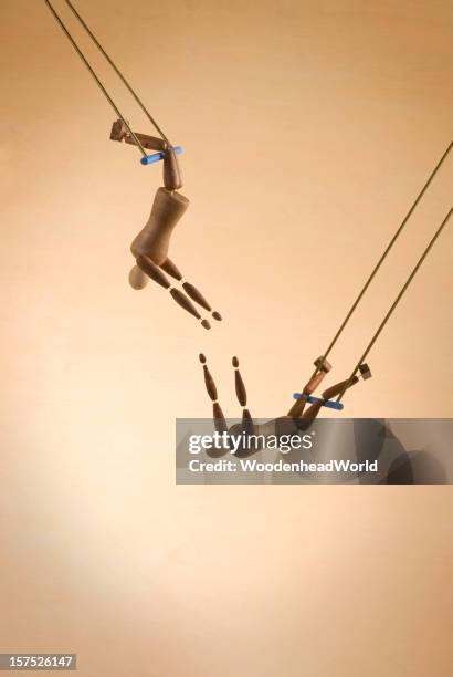 two trapeze acrobats - acrobatics gymnastics stock pictures, royalty-free photos & images