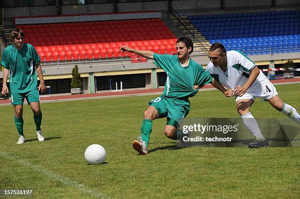 soccer players performing dirty game - foul stock pictures, royalty-free photos & images