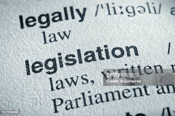 dictionary page features the word legislation in bold print - legislation stock pictures, royalty-free photos & images