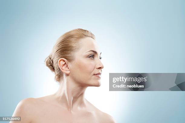 mature beauty looking into the corner. - beautiful in forties stock pictures, royalty-free photos & images