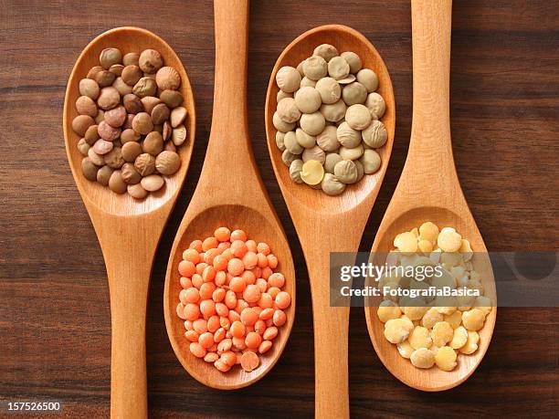 lentils and spoons - lentil stockfoto's en -beelden