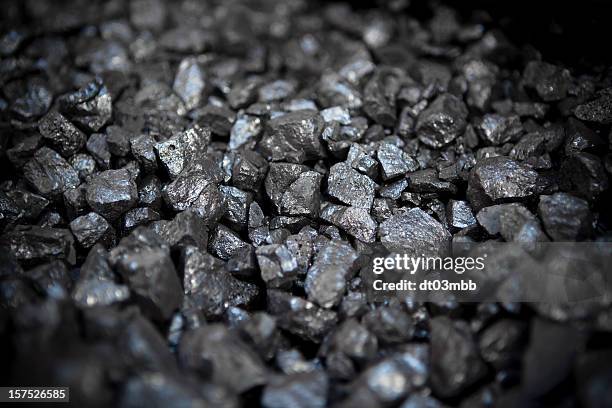 small pieces of strong metal ore - ijzer stockfoto's en -beelden