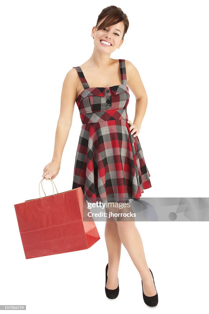 Allegro giovane donna con la borsa della spesa