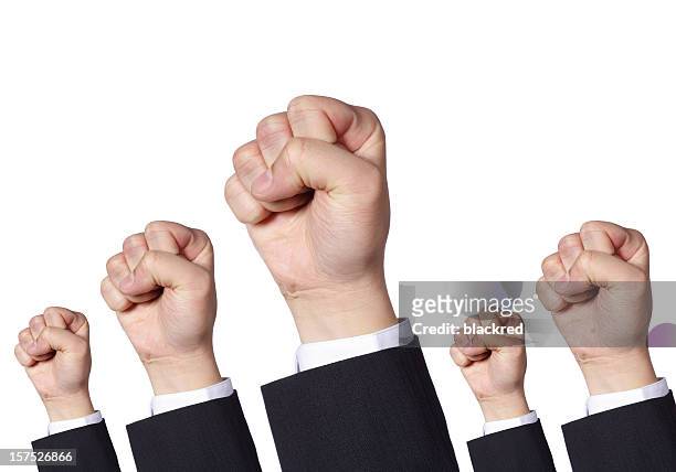 clenched fists protesting - punching stock pictures, royalty-free photos & images