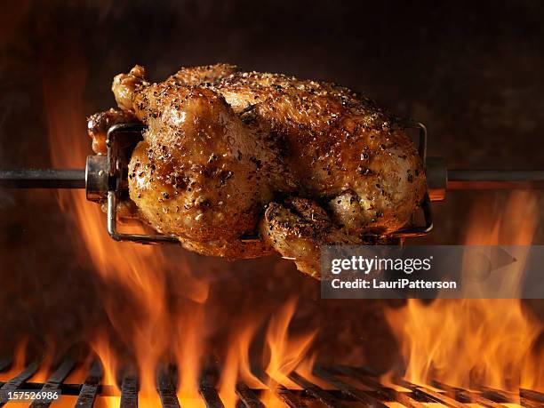 roast chicken on the bbq - geroosterd stockfoto's en -beelden