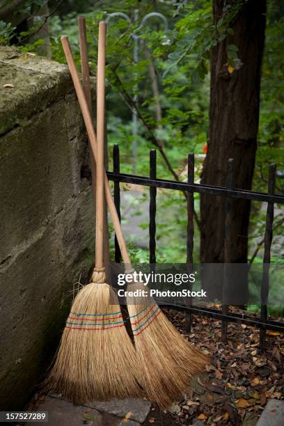 parked witch's brooms - broom moor stock pictures, royalty-free photos & images