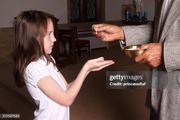 receiving communion - communion wafer stock pictures, royalty-free photos & images
