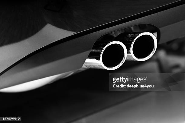 grayscale photo of car exhaust pipes - stock photo car chrome bumper stock pictures, royalty-free photos & images
