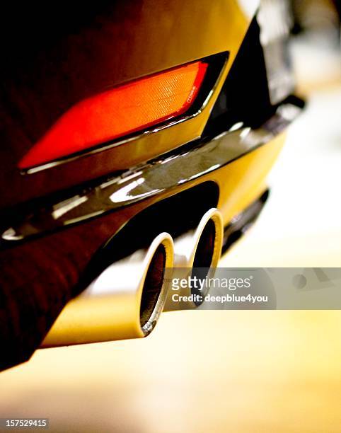 close up of car exhaust and red tail light - auto tuning stock pictures, royalty-free photos & images