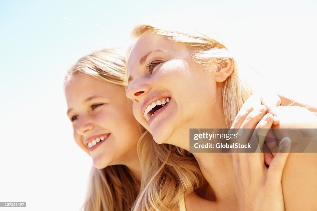 Mid adult woman having fun with her daughter