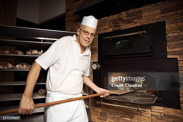 Baker Operating Machine Industrial Bakery Machine Photos and Premium High Res Pictures - Getty ...
