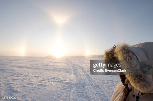 arctic sundogs or parhelion in canada's arctic. - sundog stock pictures, royalty-free photos & images