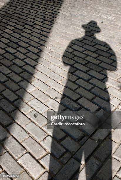 shadow man - film noir stock pictures, royalty-free photos & images