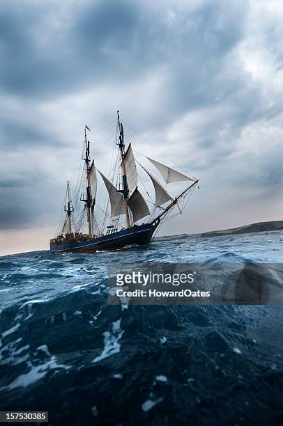 old tall sailing ship off cornwall coast - tall ship stock pictures, royalty-free photos & images
