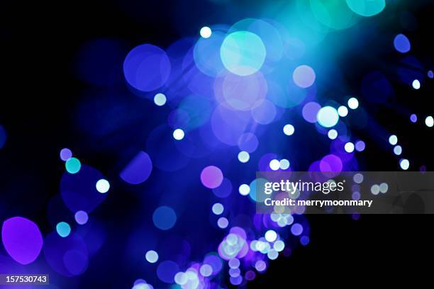 blue diagonal light burst - stage light black background stock pictures, royalty-free photos & images