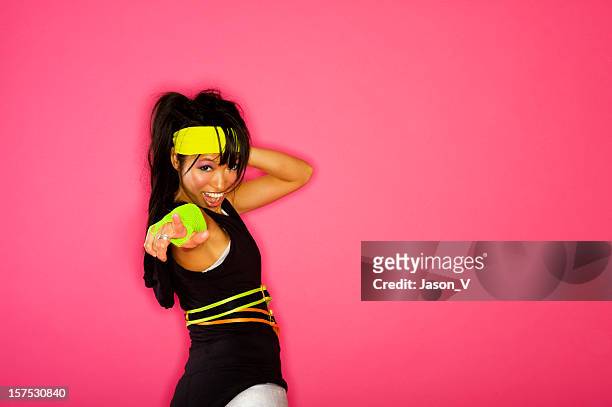 1980's fitness instructor in neon on a pink background - all hip hop models stock pictures, royalty-free photos & images
