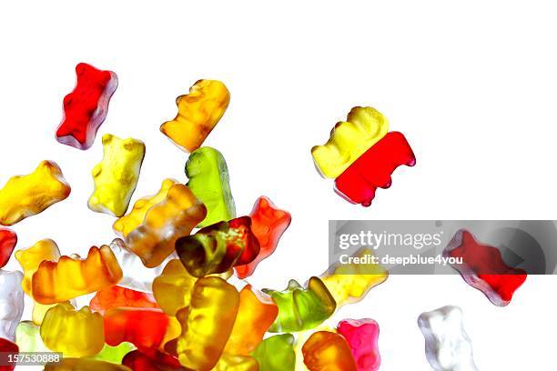 gummibears on white background - gummi bears stockfoto's en -beelden